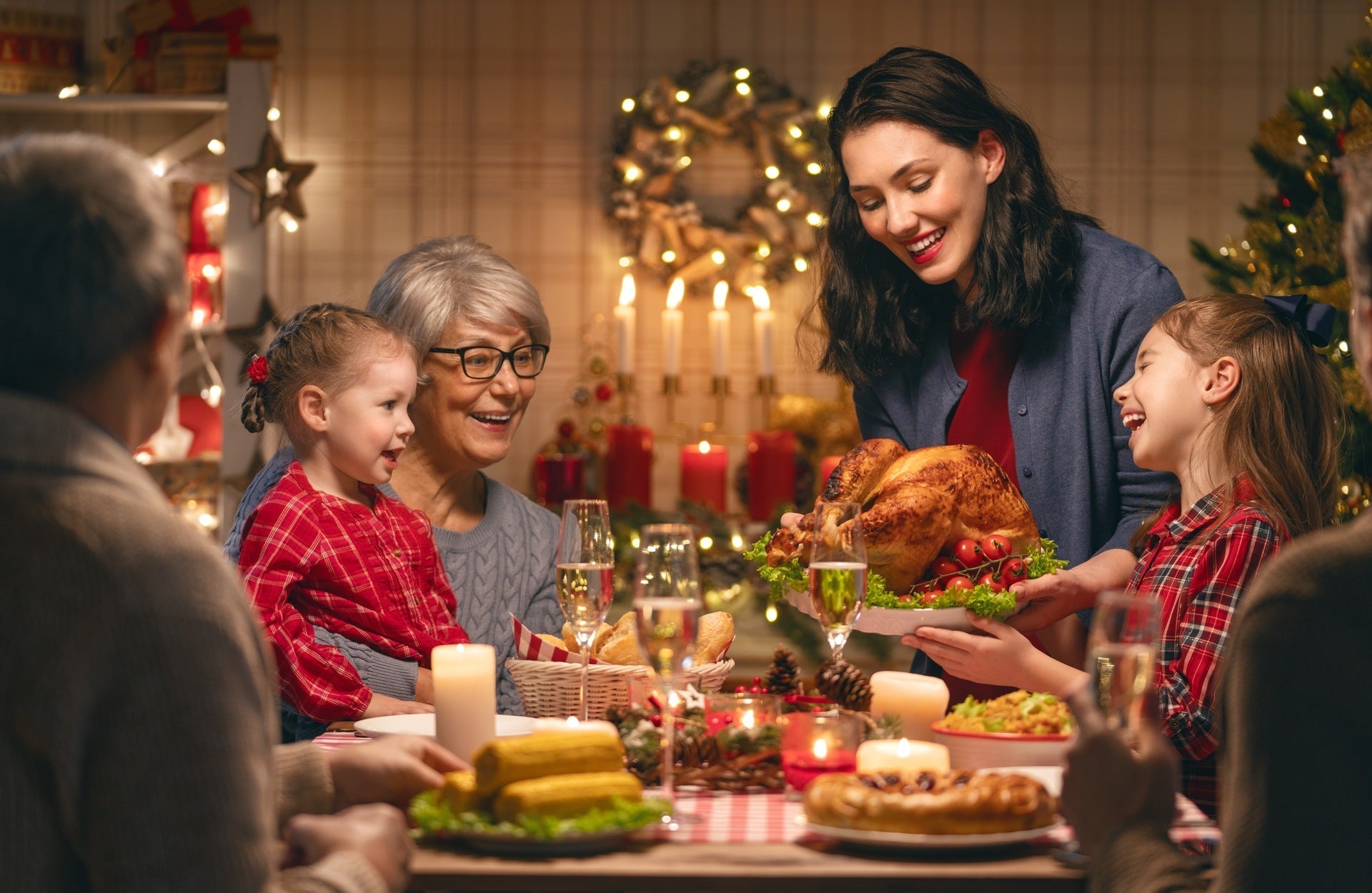 Family at the table enjoying a variety of holiday foods