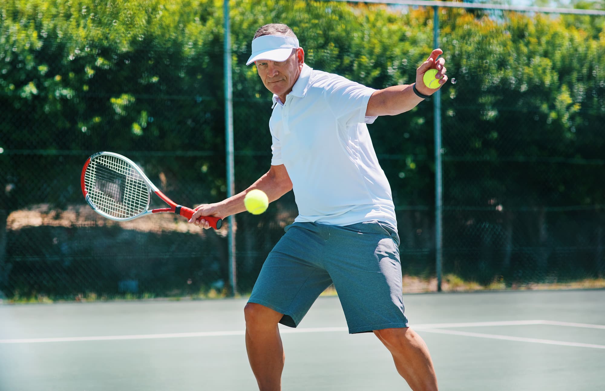 Man over-40 playing tennis, healthy aging