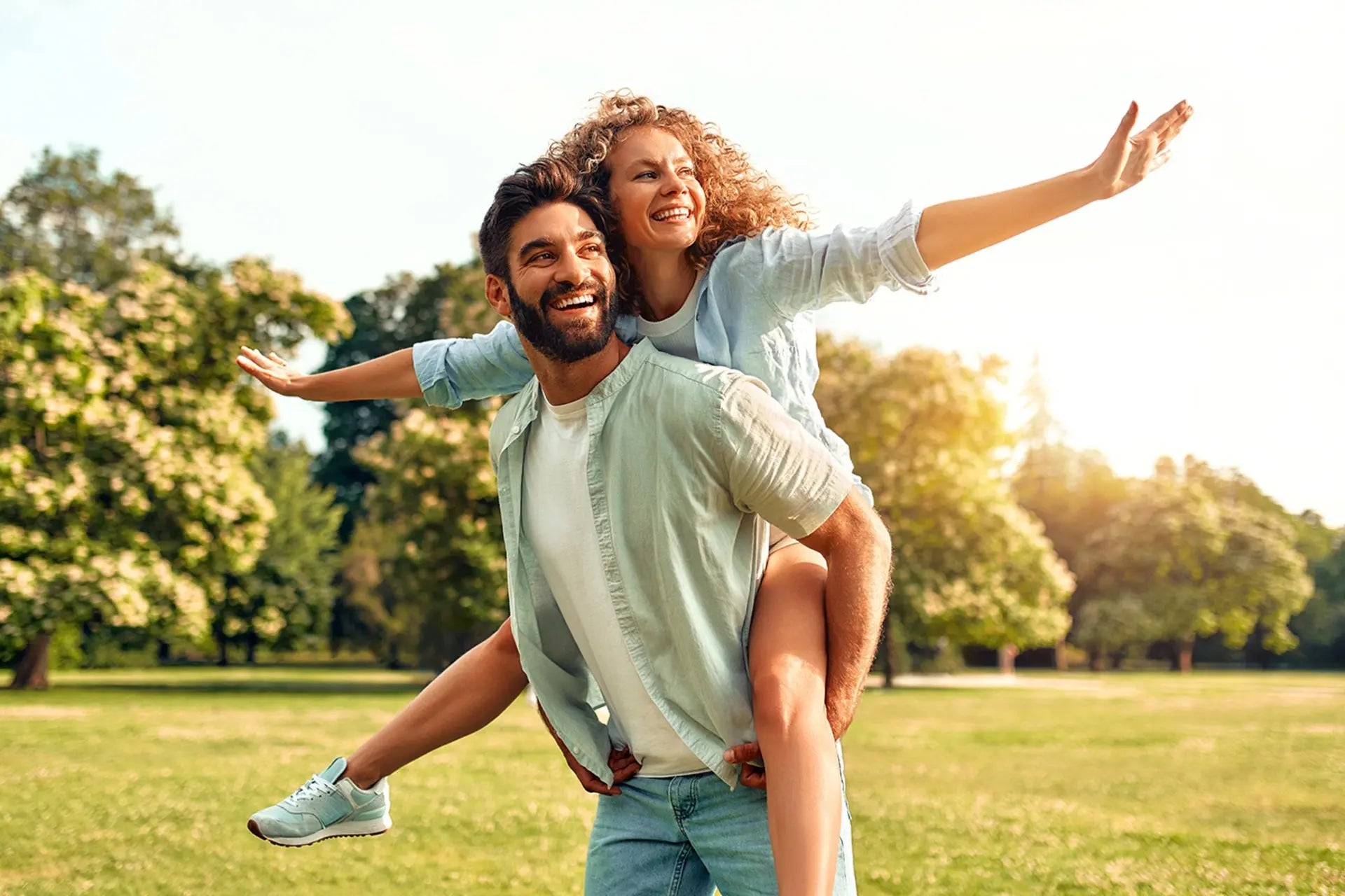 Happy couple outdoors in the park.